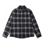 Long-sleeve button-up shirt in dark plaid with pointed collar and button front