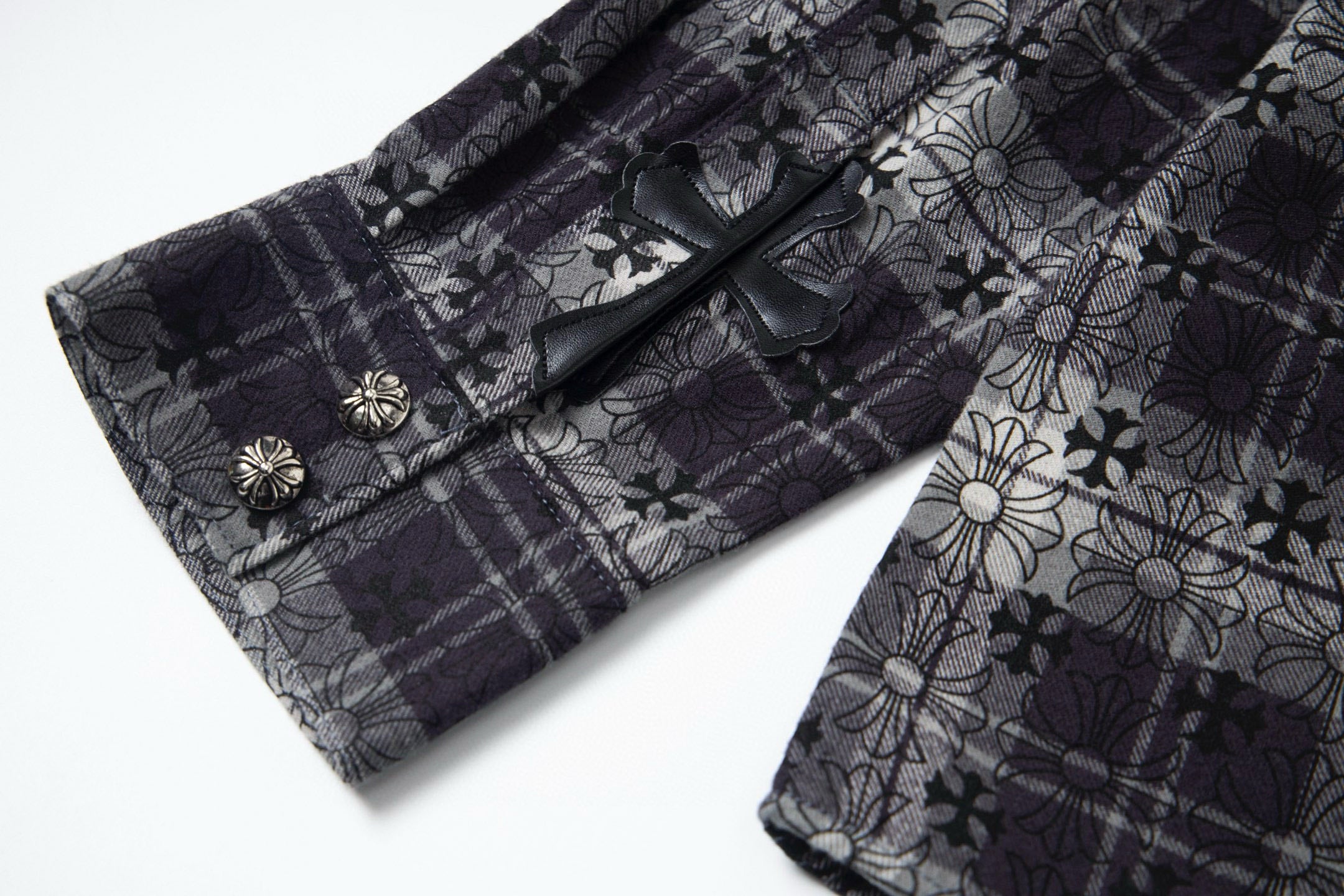 Long-sleeve button-up shirt front view showing placket with small decorative buttons