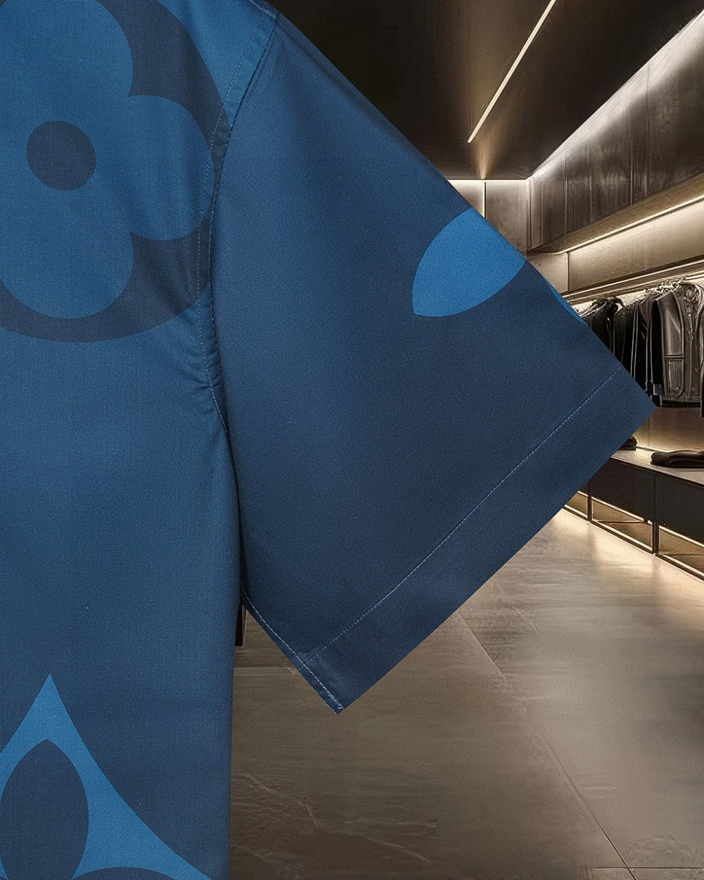 Bright blue short-sleeve shirt with tonal monogram-style print on sleeve