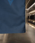 Blue button-up shirt hem with straight bottom edge and side seam