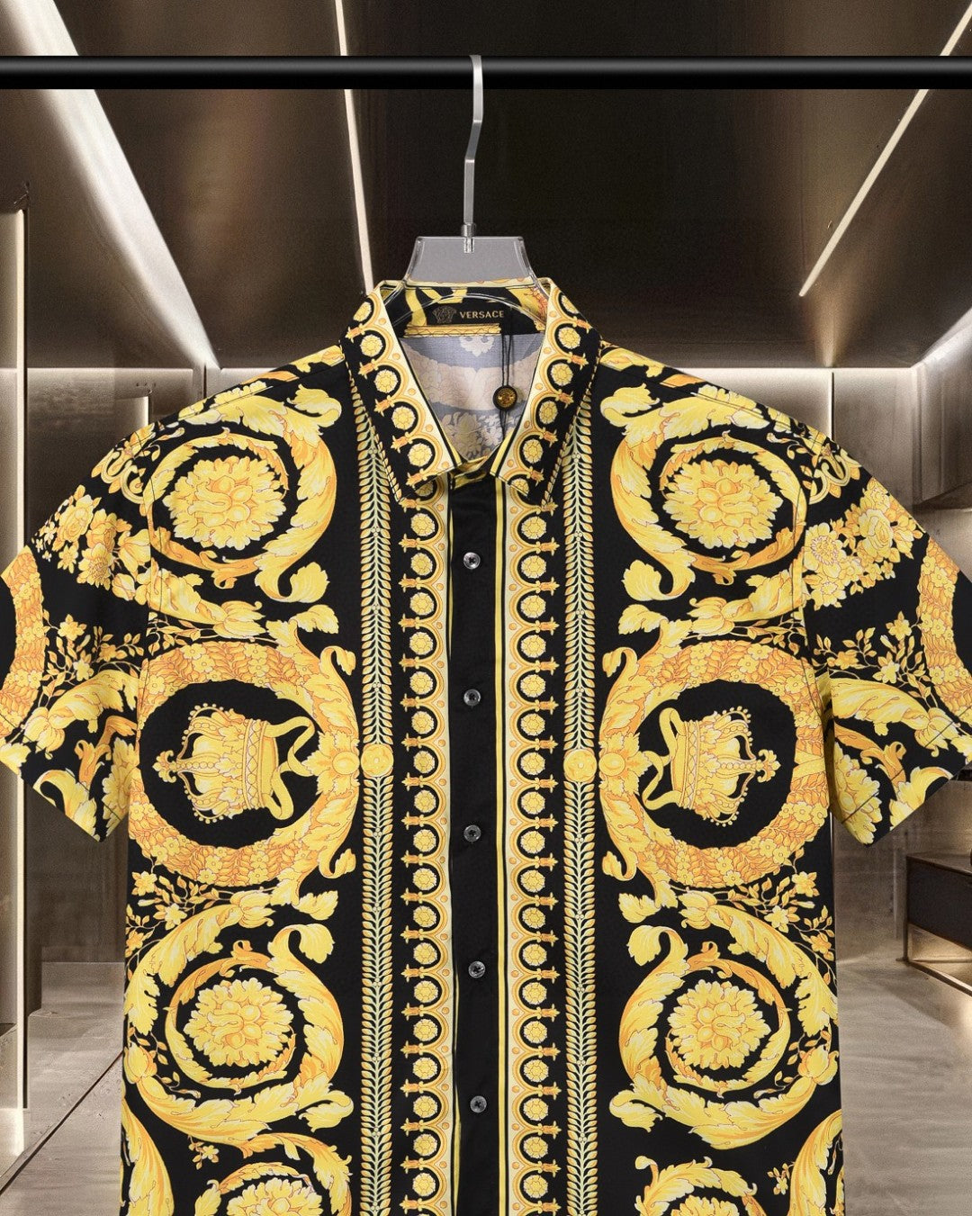 Versace short-sleeve shirt in black with gold ornate crest pattern on the sleeves