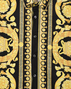 Versace short-sleeve shirt placket close-up: black center panel with gold decorative trim