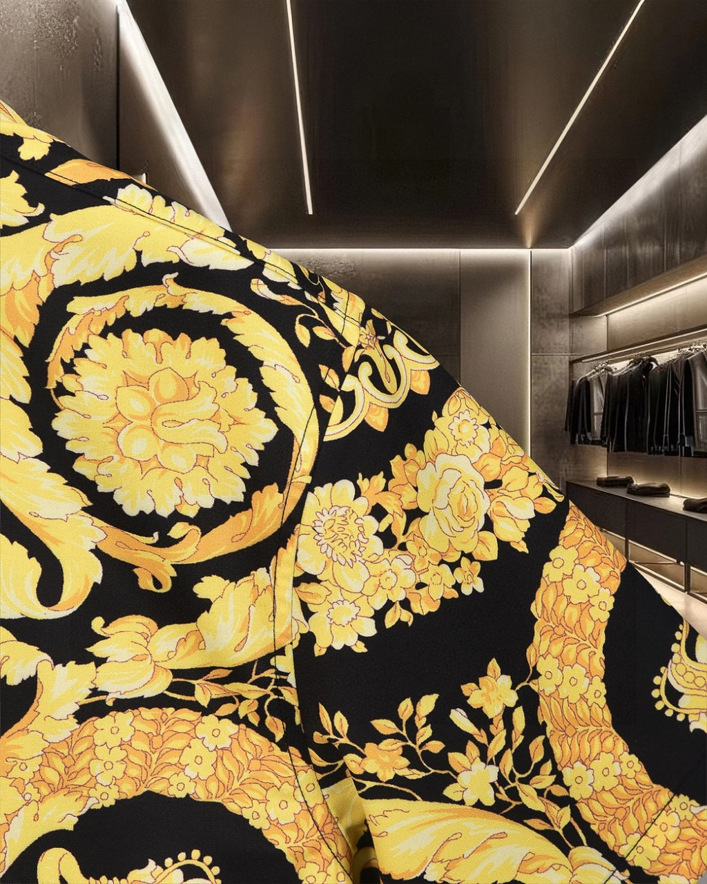 Versace short-sleeve shirt close-up with gold floral medallion print on black background