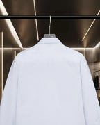 White long-sleeve button-up shirt, upper back yoke view