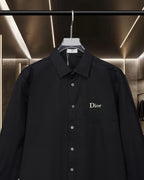 Black long-sleeve button-up shirt with pointed collar and Dior chest logo