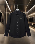 Black long-sleeve button-up shirt with Dior logo on left chest
