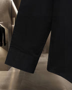 Dior black long-sleeve button-up shirt with tailored hem and front seam