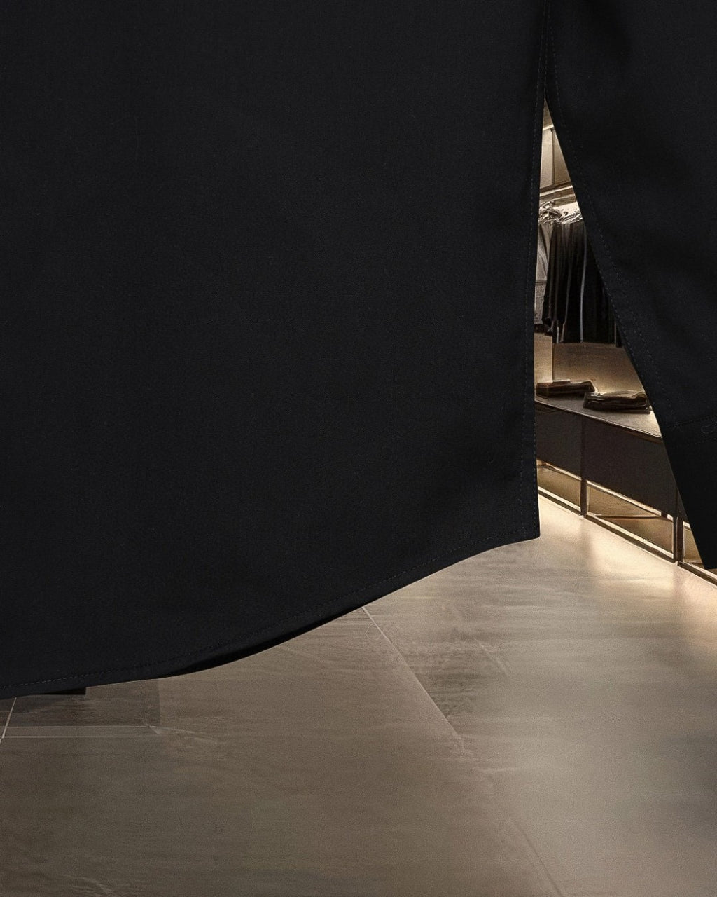 Dior black long shirt hem and side seam close-up