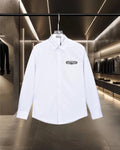 White button-up dress shirt with pointed collar and long sleeves
