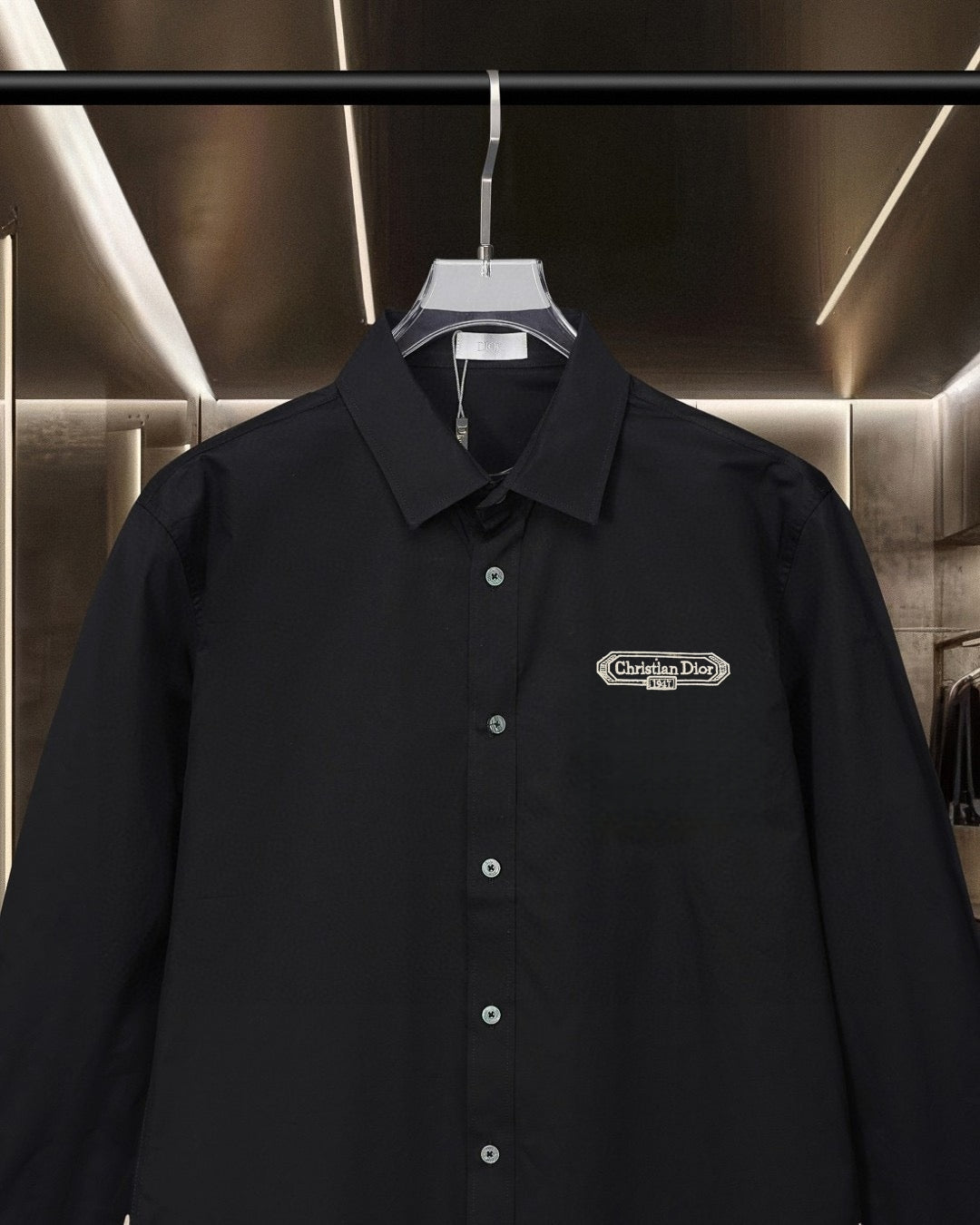Dior black button-up shirt with pointed collar and embroidered chest logo patch