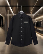 Dior black long-sleeve button-up shirt with pointed collar and chest logo patch