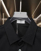 Dior black button-up shirt collar close-up with inner label and buttons