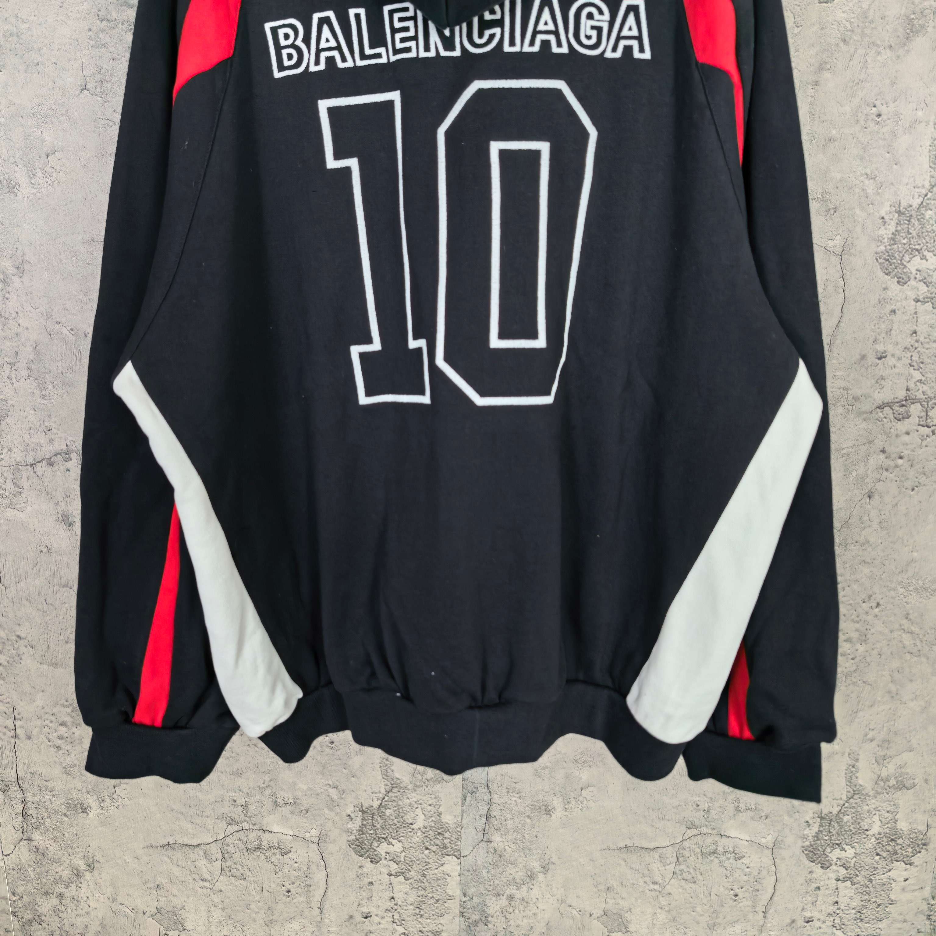Balenciaga black zip-up hoodie with BALENCIAGA 10 back print and white/red sleeve panels