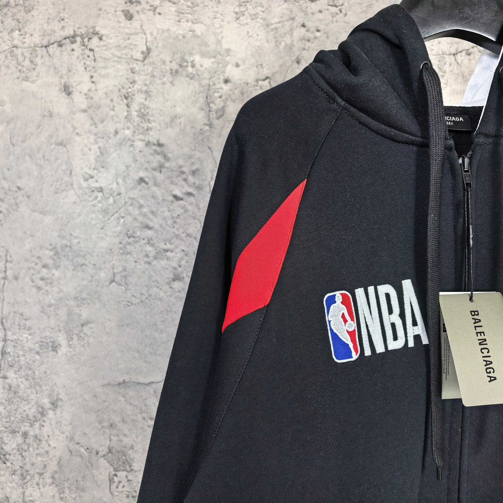 Balenciaga black zip-up hoodie with red triangle graphic and NBA logo patch