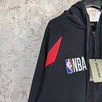 Balenciaga black zip-up hoodie with red triangle graphic and NBA logo patch