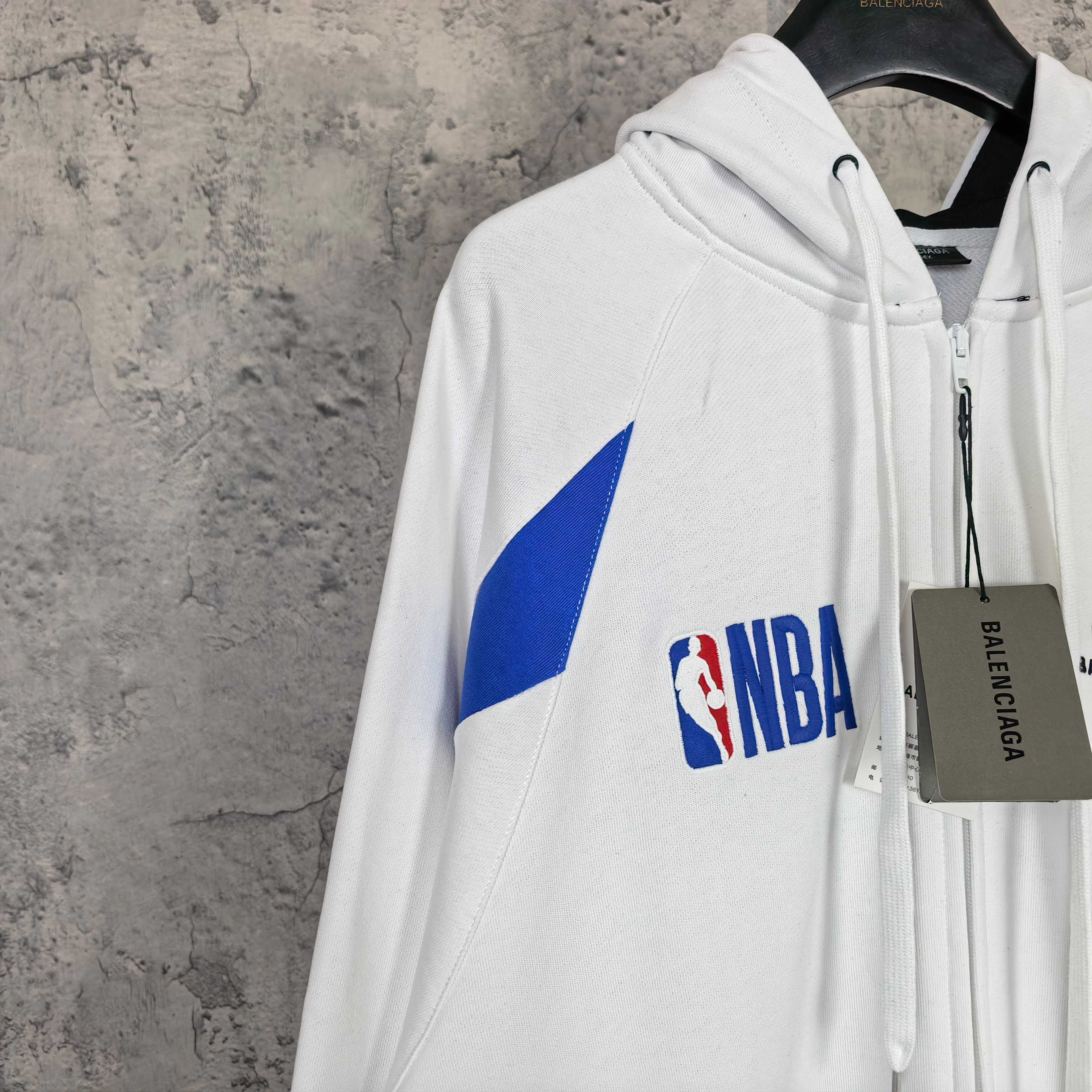 Balenciaga long zip hoodie white with blue sleeve triangle and NBA logo, hanging tag