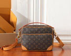 Monogram crossbody bag with tan leather trim, top handle and shoulder strap