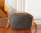 Monogram crossbody bag front view with gold-tone hardware and top handle