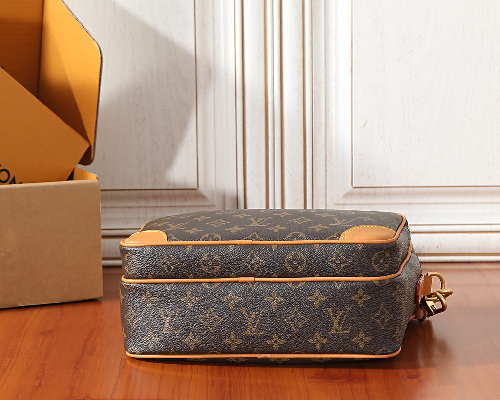 Monogram crossbody bag back view with curved top and adjustable shoulder strap