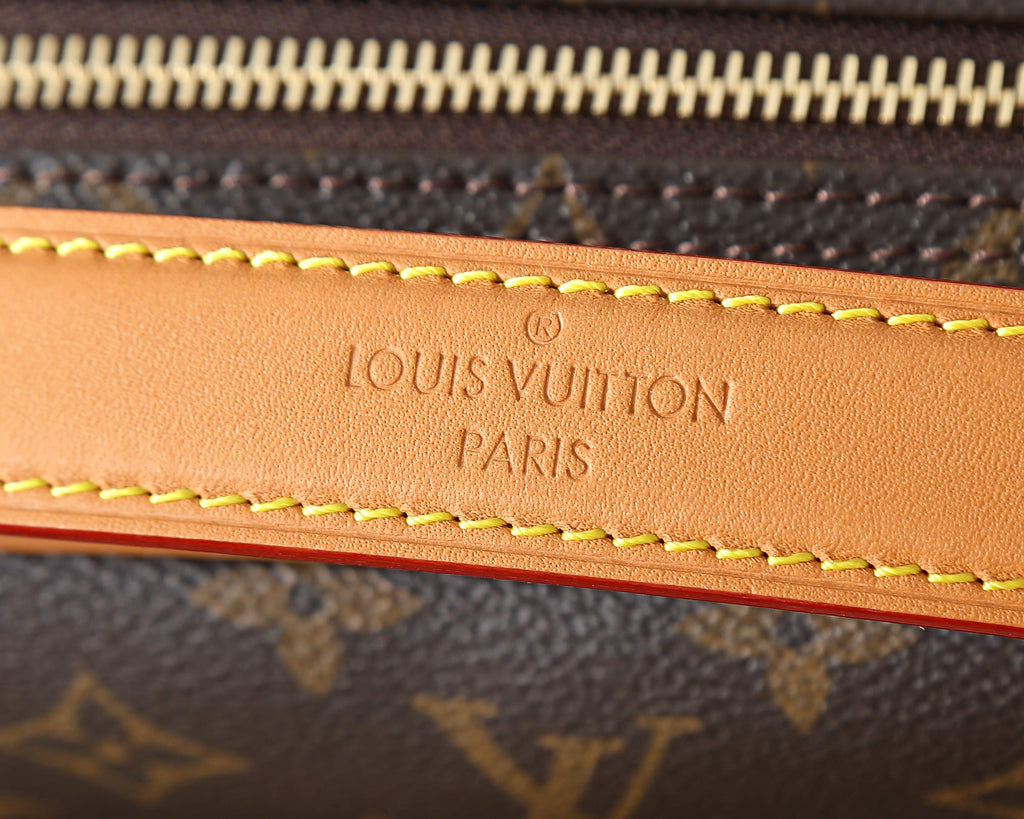 Louis Vuitton Paris stamped leather trim with contrast tan-and-red stitching