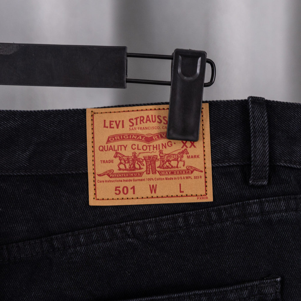 Levi Strauss 501 W label inside waistband of black denim pants