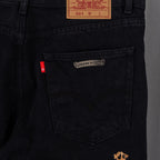 Black denim pants front pocket with embossed leather logo patch