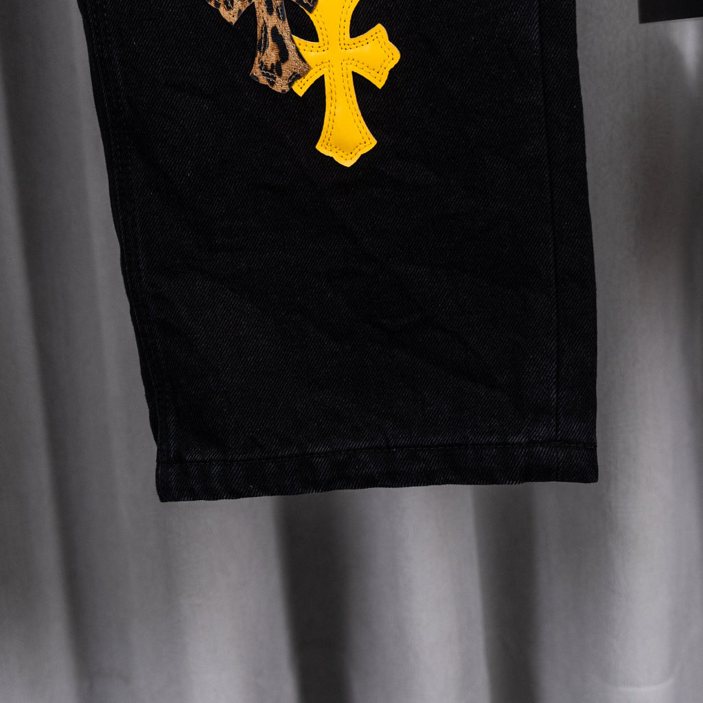 Black denim pants hem with stitched cuff at the bottom