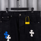 Black denim pants with cross patches, center waist button and drawstring tag.