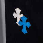 Black denim pants with white and blue cross patches