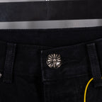 Black denim pants with silver button and inner pocket seam detail