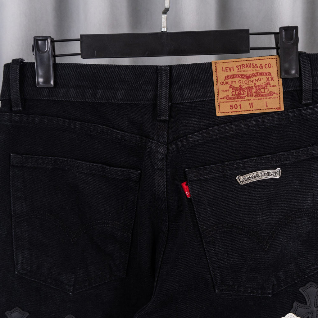 Black denim pants with Levi Strauss & Co label near waistband