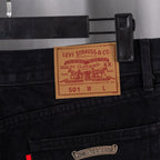 Black denim pants with Levi Strauss & Co label and small rectangular tag