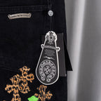 Black denim Chrome pants with leopard-style graphic and hanging tag