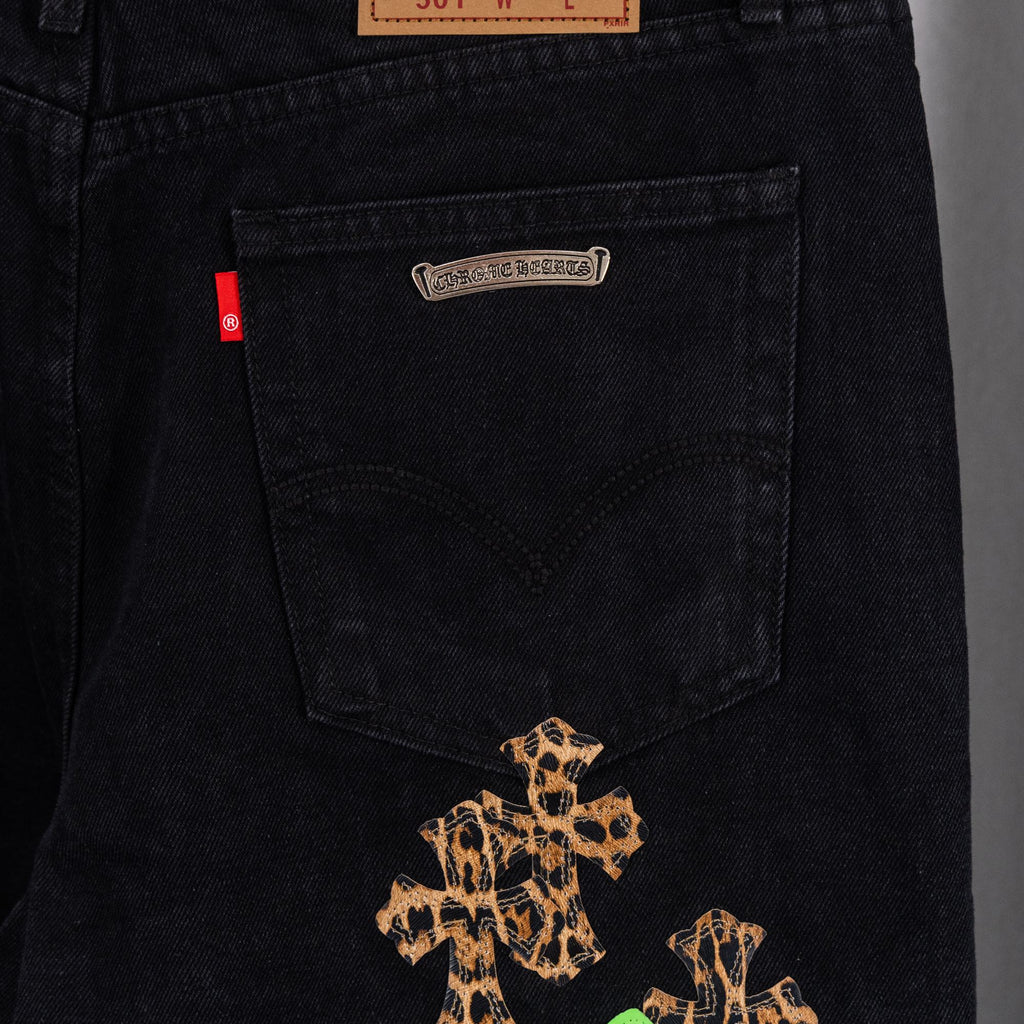 Black denim Chrome pants with leopard graphic on front pocket