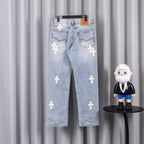 Light blue denim jeans with white cross patches, distressed wash, belt loops.