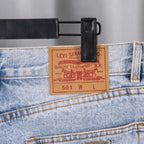 Levi Strauss denim waistband tag with belt loops and white cross patches.