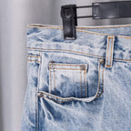 Light blue denim jeans front patch pockets with metal button