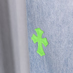 Denim pants with neon green cross patch on leg