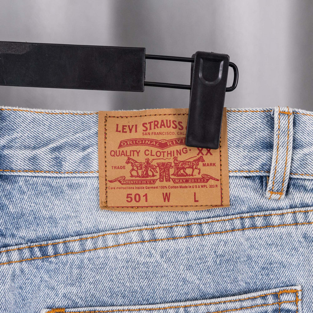 Denim jeans with Levi Strauss 501 tag and metal button