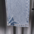 Light blue denim pants hem and side seam close-up