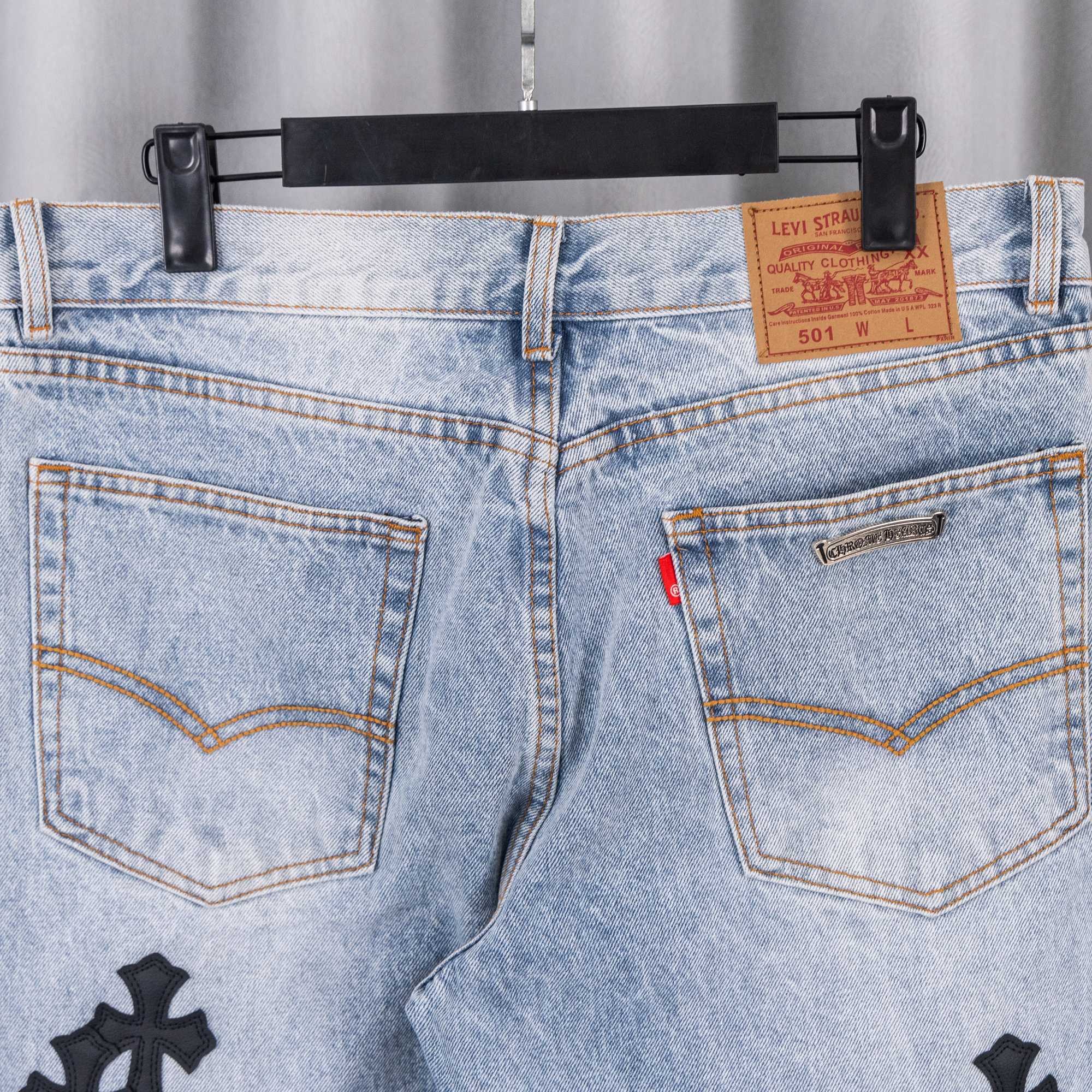 Light wash denim pants with dual pockets and Levi Strauss leather patch