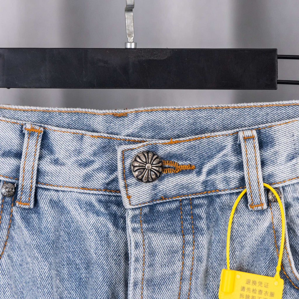 Denim pants waistband pocket detail with metal button and hanging tag