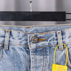 Denim pants waistband pocket detail with metal button and hanging tag