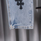 Light blue denim pants hem with frayed cuff and straight leg opening
