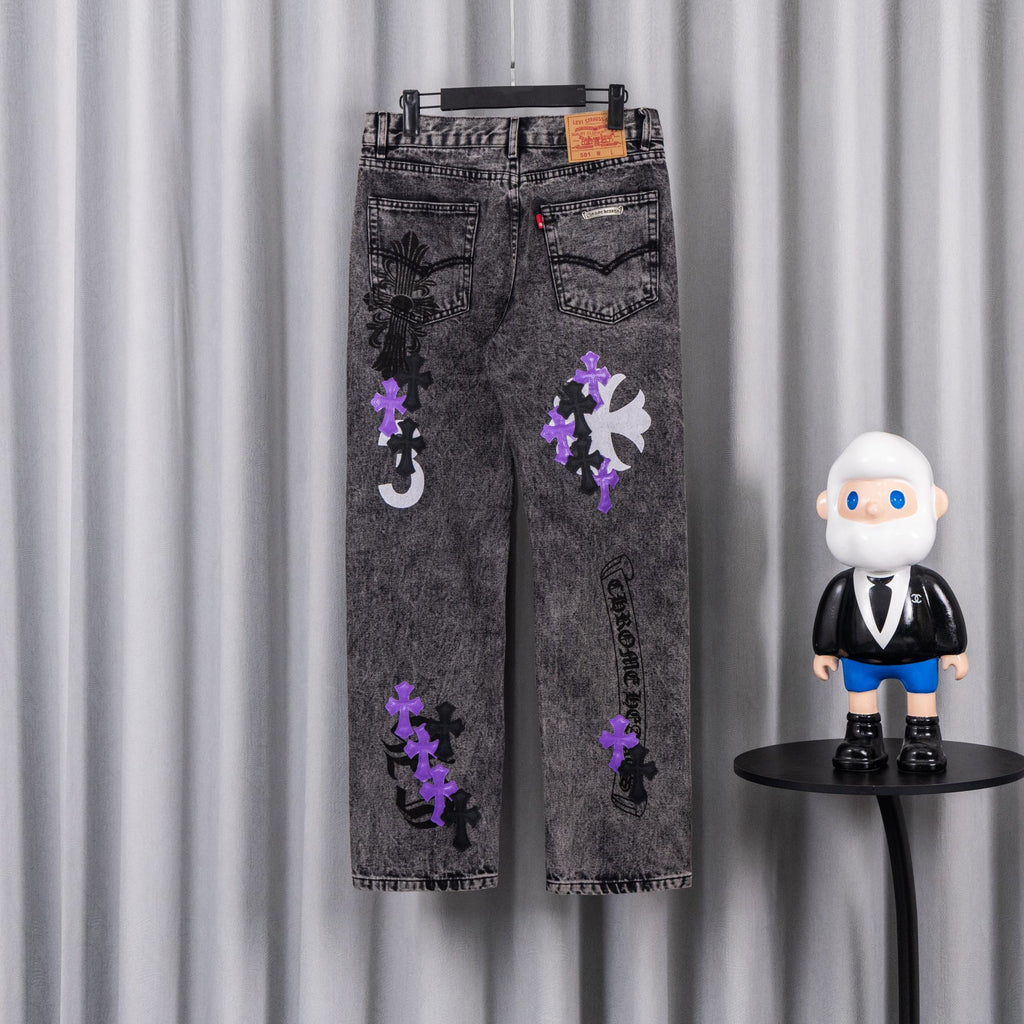 Chrome pants with gray wash and scattered purple and black patches on the front