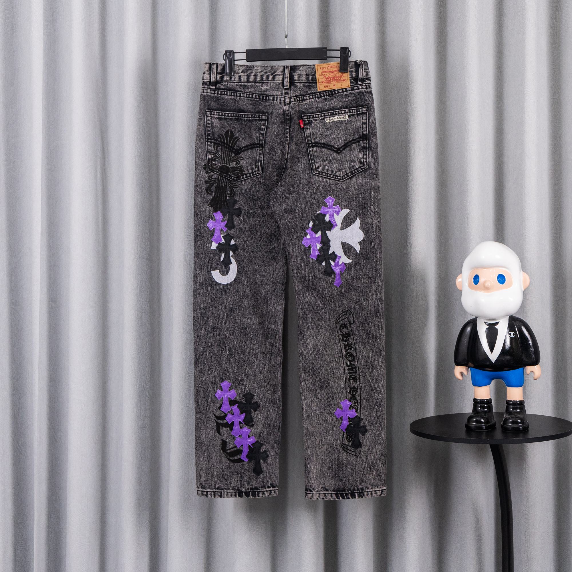 Chrome pants with gray wash and scattered purple and black patches on the front