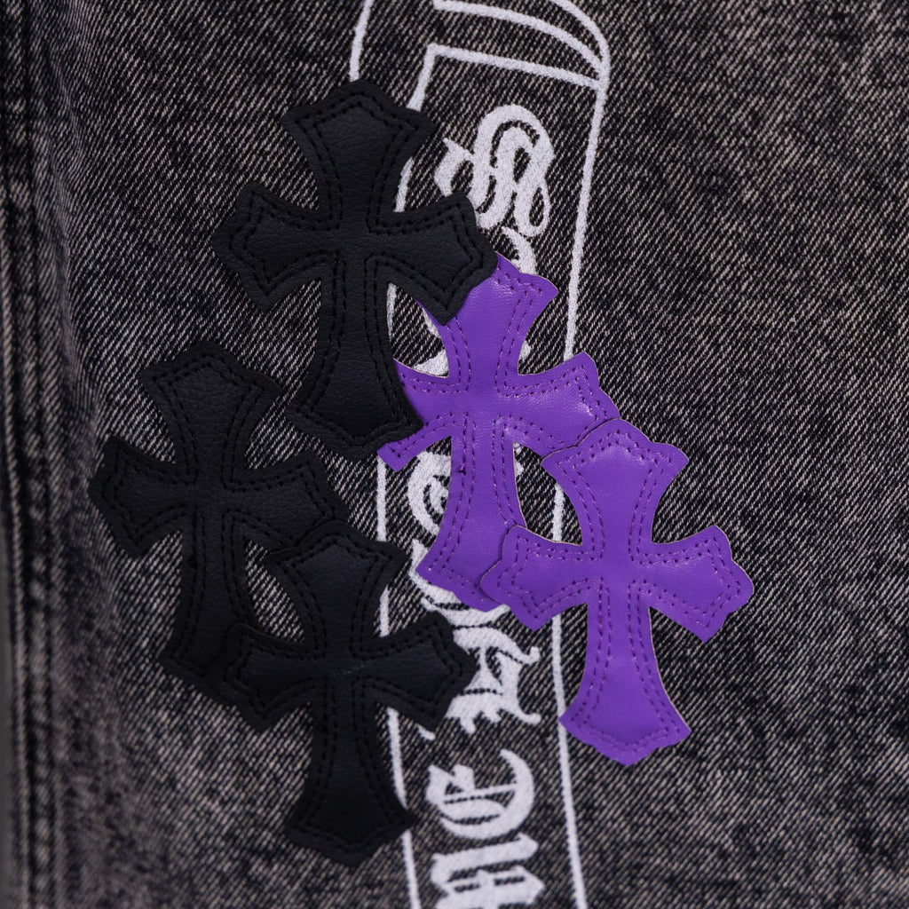 Chrome pants patch close-up with purple cross graphic and black crossed icons