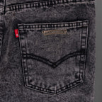 Chrome pants back pocket close-up with leather-like patch and stitched V seam