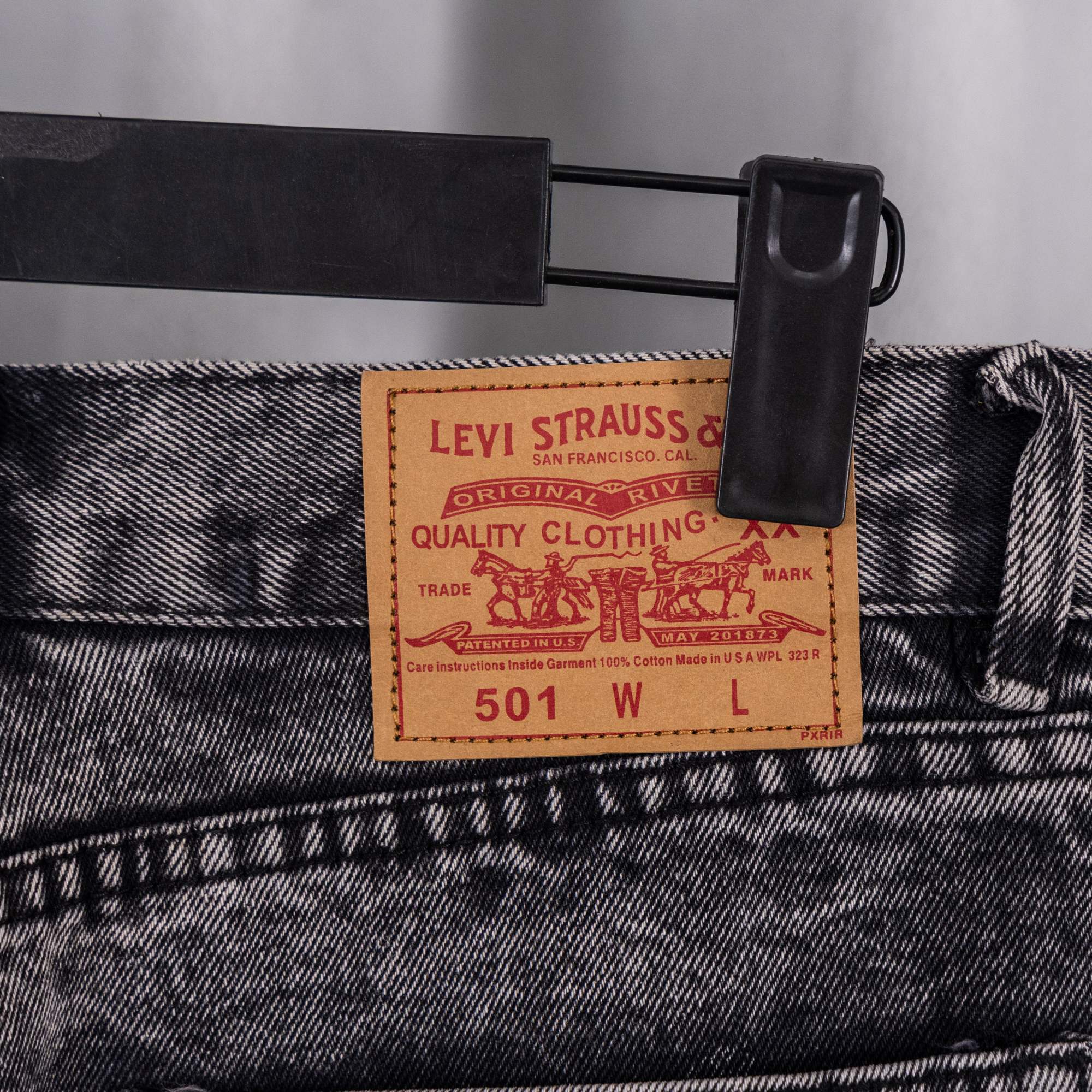 Chrome pants in dark denim with stitched leather logo patch at waistband