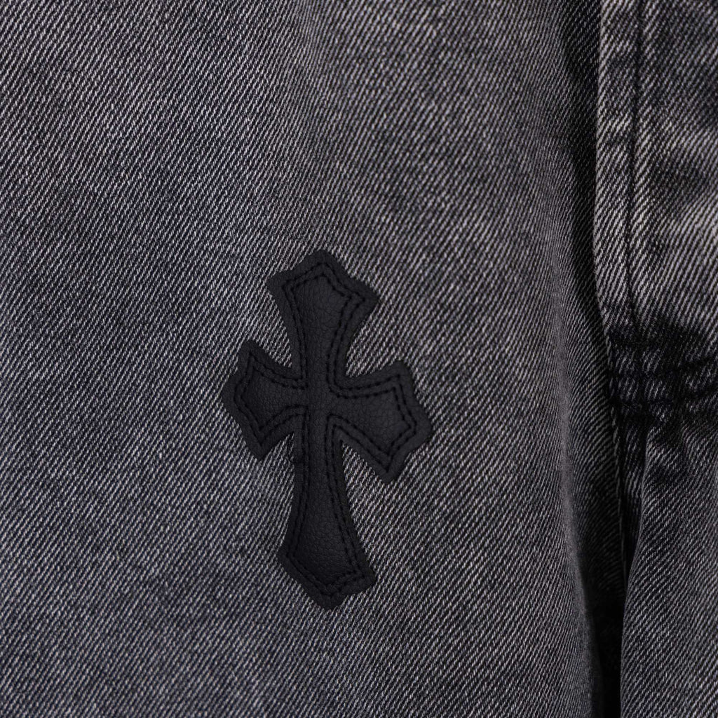 Chrome pants with cross patch on denim leg